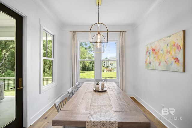 313 Cuban Lily Dr, Fairhope, AL 36532 - dining room with wood finished floors, a chandelier, and baseboards