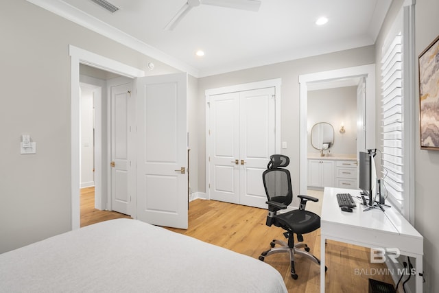 313 Cuban Lily Dr, Fairhope, AL 36532 - bedroom with light wood-style floors, a desk, recessed lighting, ensuite bathroom, and a closet