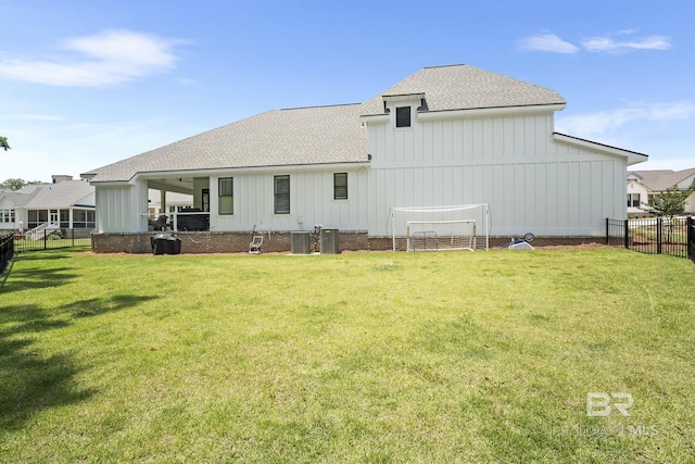 313 Cuban Lily Dr, Fairhope, AL 36532 - rear view of house with a shingled roof, central AC unit, and board and batten siding