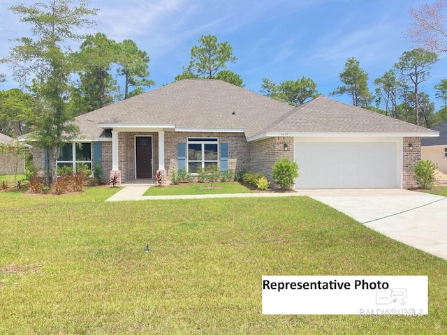 view of front of property with a front yard and a garage