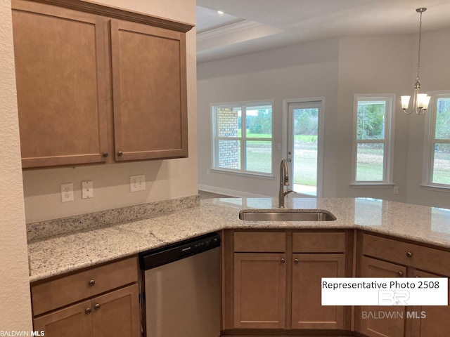 kitchen featuring sink, dishwasher, light stone counters, and a healthy amount of sunlight