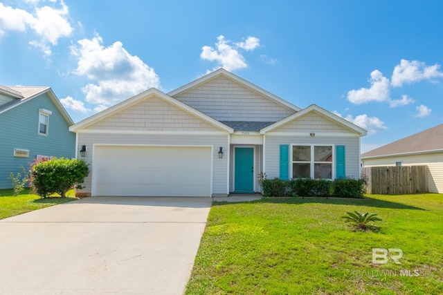 view of front of home with a garage and a front yard