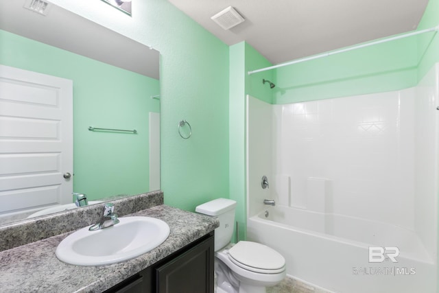 full bathroom with vanity, toilet, and  shower combination