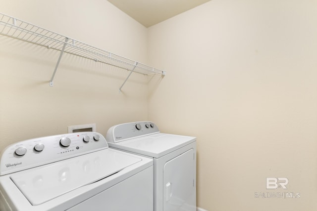 laundry room featuring washing machine and clothes dryer