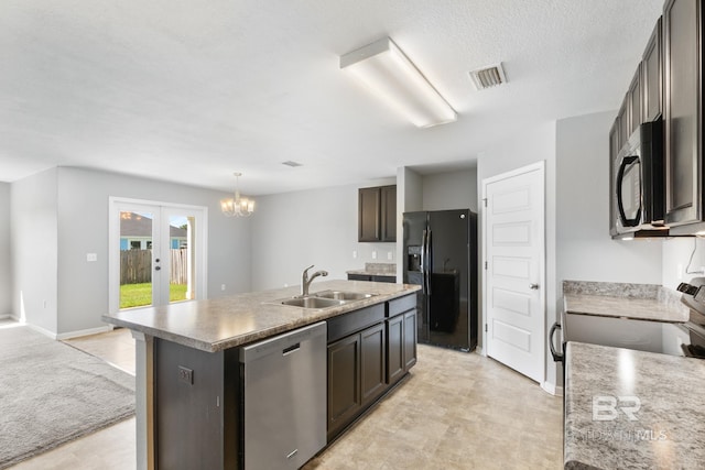 kitchen with a chandelier, sink, stainless steel appliances, a center island with sink, and dark brown cabinetry