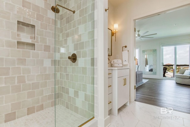 ensuite bathroom featuring ensuite bath, marble finish floor, a tile shower, and ceiling fan