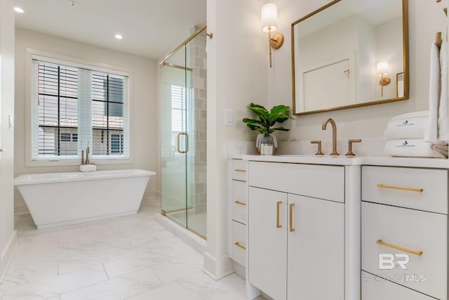 full bath featuring vanity, marble finish floor, a shower stall, and a freestanding bath