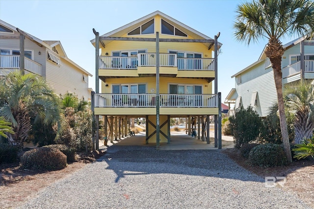 beach home featuring a carport and a balcony