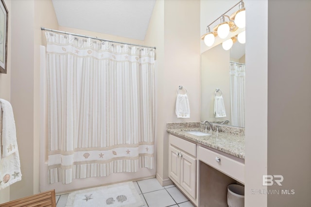 bathroom featuring tile patterned floors, vanity, and shower / bathtub combination with curtain