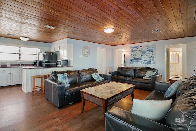 747 Cherokee Rd, Gulf Shores, AL 36542 - living room with wood ceiling, wood finished floors, and visible vents