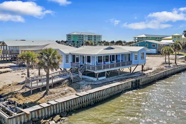 747 Cherokee Rd, Gulf Shores, AL 36542 - back of property with a water view and metal roof