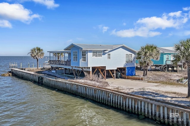 747 Cherokee Rd, Gulf Shores, AL 36542 - back of property with a water view, metal roof, and a carport