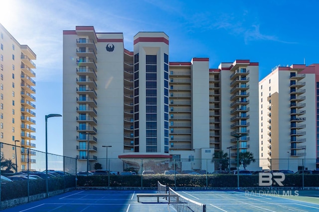 24230 Perdido Beach Blvd Unit 3112, Orange Beach, AL 36561 - view of property with uncovered parking and fence