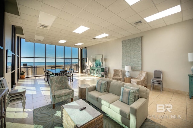 24230 Perdido Beach Blvd Unit 3112, Orange Beach, AL 36561 - tiled living area featuring a wall of windows, visible vents, and a drop ceiling