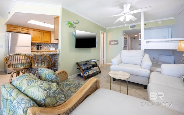 24230 Perdido Beach Blvd Unit 3112, Orange Beach, AL 36561 - living room featuring visible vents, baseboards, ornamental molding, light tile patterned floors, and a ceiling fan