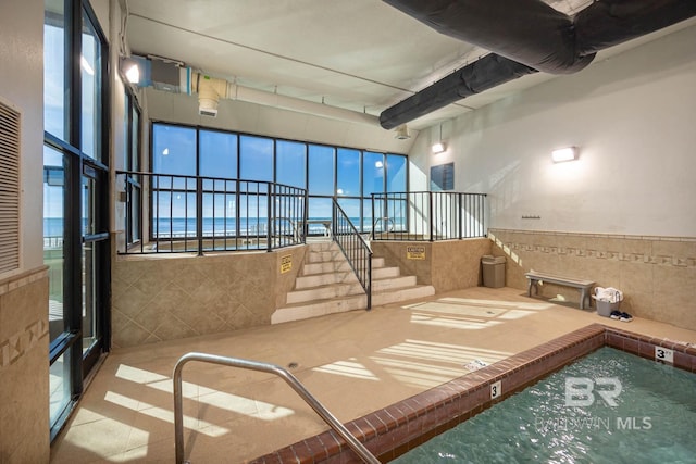 24230 Perdido Beach Blvd Unit 3112, Orange Beach, AL 36561 - interior space with tile walls and stairs