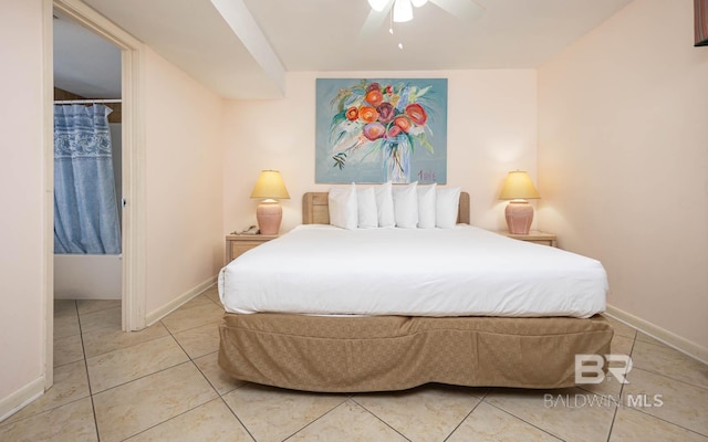 24230 Perdido Beach Blvd Unit 3112, Orange Beach, AL 36561 - bedroom featuring light tile patterned floors, baseboards, and a ceiling fan