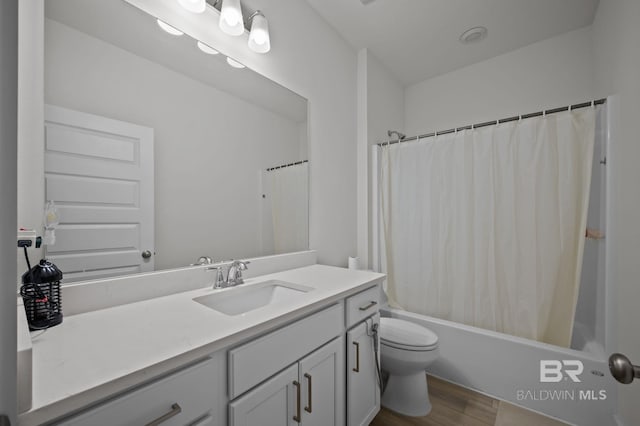 full bathroom with toilet, vanity, shower / bath combo, and wood finished floors