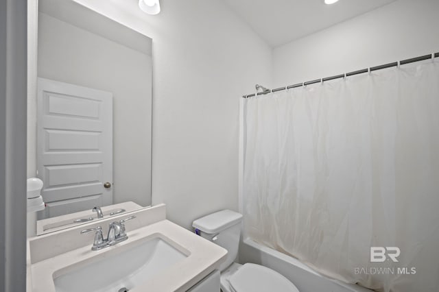 full bathroom with shower / bath combo, vanity, and toilet