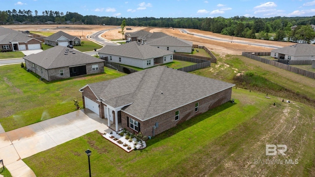birds eye view of property with a residential view