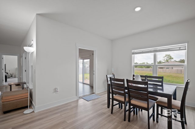 dining room featuring recessed lighting, light wood-style flooring, and baseboards