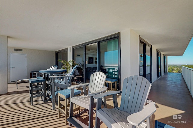 25020 Perdido Beach Blvd Unit 1101B, Orange Beach, AL 36561 - view of patio featuring a balcony and outdoor dining space
