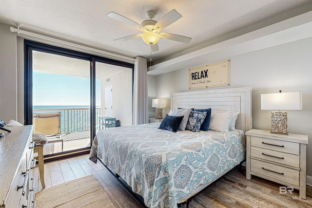 25020 Perdido Beach Blvd Unit 1101B, Orange Beach, AL 36561 - bedroom featuring light wood-style floors, access to outside, and ceiling fan