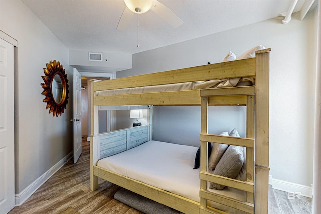 25020 Perdido Beach Blvd Unit 1101B, Orange Beach, AL 36561 - bedroom with wood finished floors, baseboards, and ceiling fan