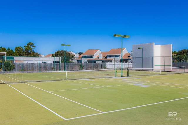 25020 Perdido Beach Blvd Unit 1101B, Orange Beach, AL 36561 - view of tennis court with community basketball court and a residential view