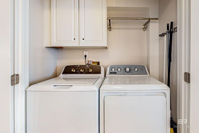 25020 Perdido Beach Blvd Unit 1101B, Orange Beach, AL 36561 - laundry area featuring cabinet space and independent washer and dryer