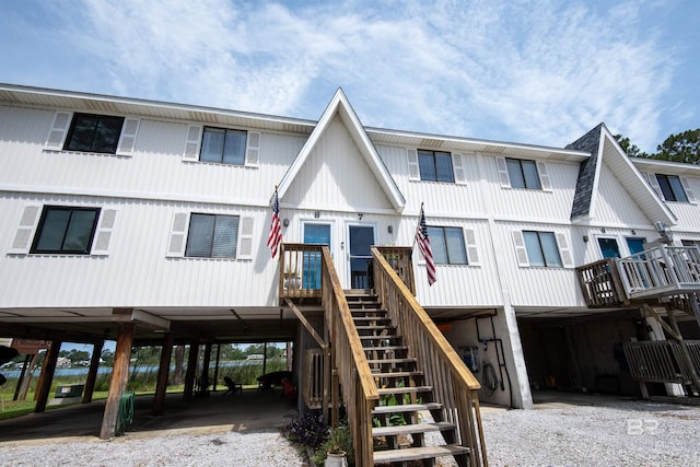 112 W 8th Ave Unit 7, Gulf Shores, AL 36542 - view of front of house with stairway and a carport
