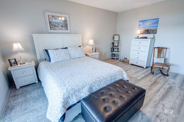 112 W 8th Ave Unit 7, Gulf Shores, AL 36542 - bedroom featuring light wood-style flooring and baseboards