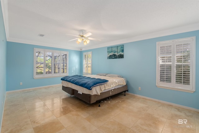 bedroom with ceiling fan and ornamental molding