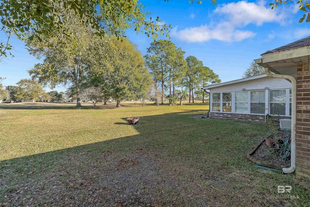 view of yard with a sunroom