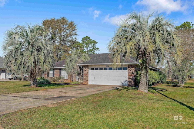 view of front facade with a front yard and a garage