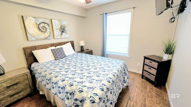 bedroom with ceiling fan and dark hardwood / wood-style floors