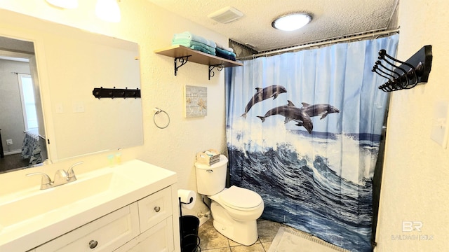 bathroom featuring a textured ceiling, tile patterned flooring, vanity, toilet, and a shower with shower curtain