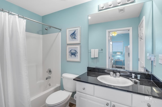 full bathroom with toilet, shower / bath combo, visible vents, and vanity