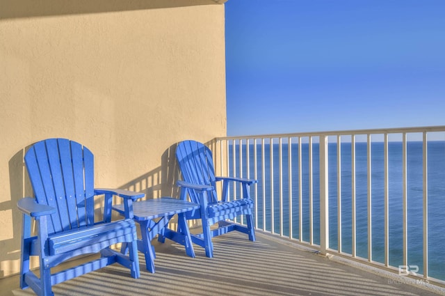 balcony featuring a water view