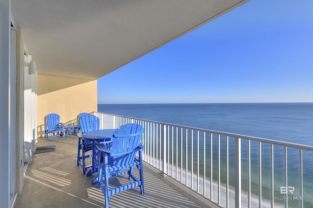 balcony featuring a water view