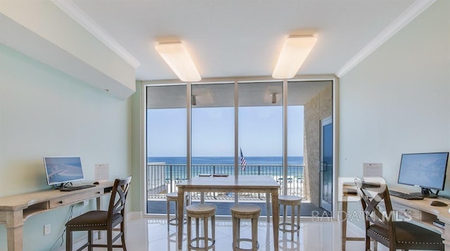 dining space with a wall of windows, crown molding, and baseboards