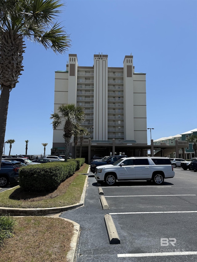 view of property featuring uncovered parking