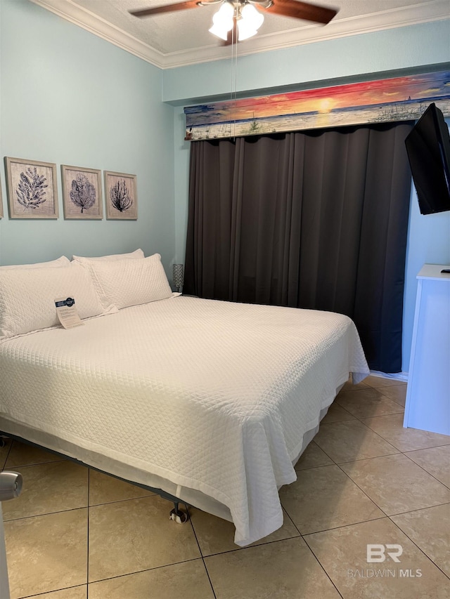 bedroom with ornamental molding, light tile patterned flooring, and ceiling fan