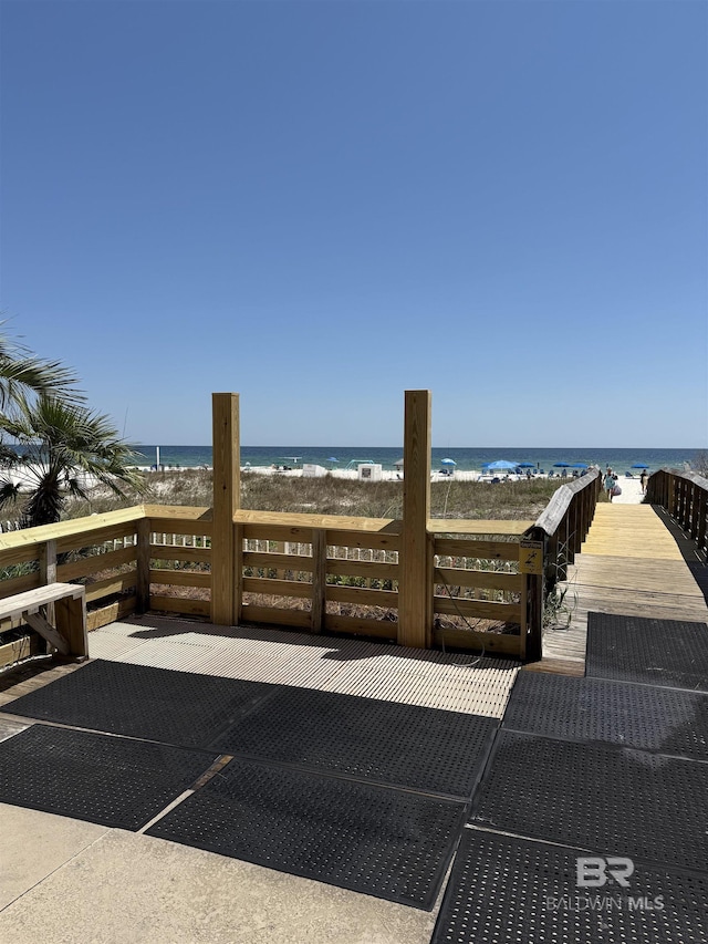 view of patio / terrace with a view of the beach and a water view