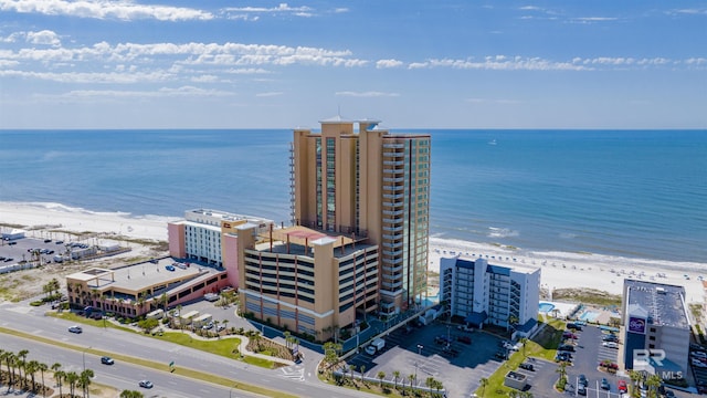 aerial view featuring a water view and a view of the beach