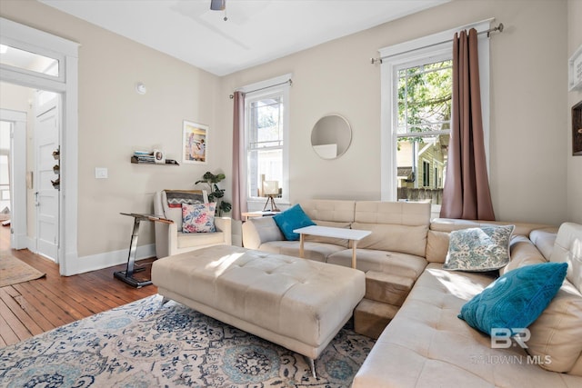 living room with hardwood / wood-style flooring, a healthy amount of sunlight, and ceiling fan