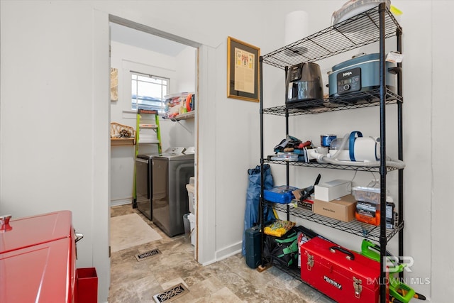 washroom with washing machine and clothes dryer