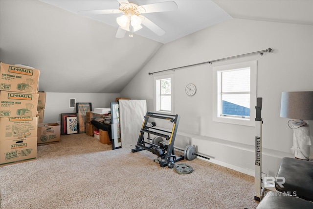 exercise area featuring lofted ceiling, carpet flooring, and ceiling fan