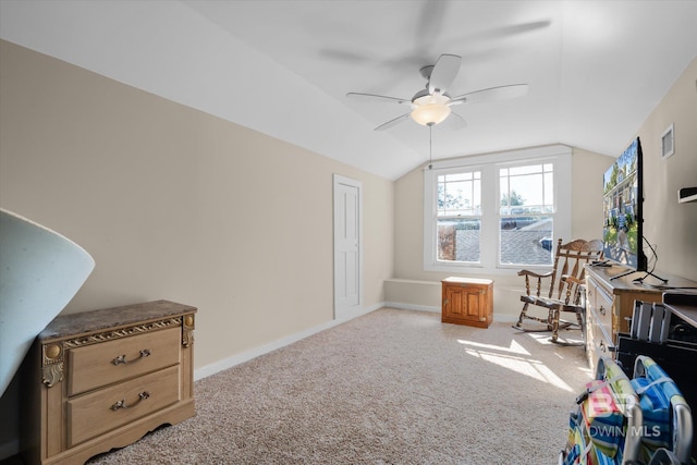 home office with light carpet, ceiling fan, and vaulted ceiling