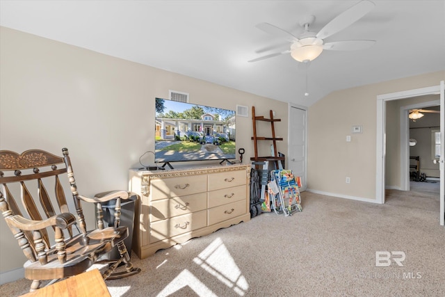 interior space featuring light carpet and ceiling fan